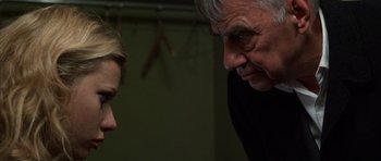 Movie still from “Hard Eight” (1996), directed by Paul Thomas Anderson – An older man and a younger woman talking to each other; Close Up shot, Over the shoulder angle