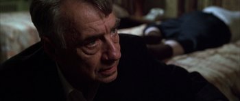 Movie still from “Hard Eight” (1996), directed by Paul Thomas Anderson – A person looking at the camera; Close Up shot, Over the shoulder angle