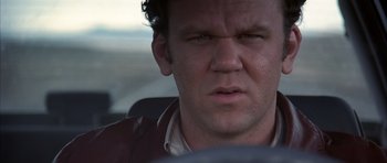 Movie still from “Hard Eight” (1996), directed by Paul Thomas Anderson – A person in a car; Close Up shot, Low angle
