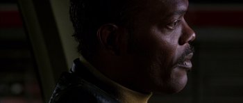 Movie still from “Hard Eight” (1996), directed by Paul Thomas Anderson – A man's face in the dark; Close Up shot, Low angle