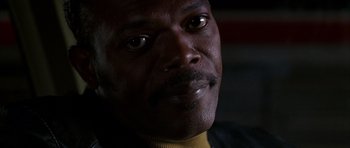 Movie still from “Hard Eight” (1996), directed by Paul Thomas Anderson – A man's face in a dark room; Close Up shot, Low angle