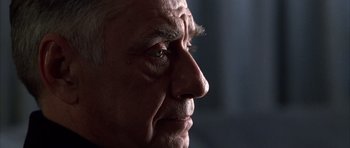 Movie still from “Hard Eight” (1996), directed by Paul Thomas Anderson – An older man with a goatee looking off into the distance; Close Up shot, Low angle