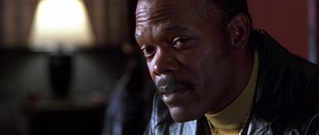 Movie still from “Hard Eight” (1996), directed by Paul Thomas Anderson – A man's face in a leather jacket; Close Up shot, Low angle