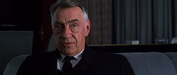 Movie still from “Hard Eight” (1996), directed by Paul Thomas Anderson – An older man wearing a suit and tie; Close Up shot, Low angle