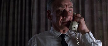Movie still from “Hard Eight” (1996), directed by Paul Thomas Anderson – An older man talking on a phone while wearing a tie; Close Up shot, Low angle