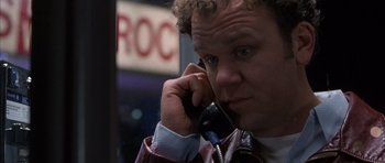 Movie still from “Hard Eight” (1996), directed by Paul Thomas Anderson – A person talking on a cell phone; Close Up shot, Low angle