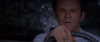 Movie still from “Hard Eight” (1996), directed by Paul Thomas Anderson – A person holding a steering wheel; Close Up shot, Low angle