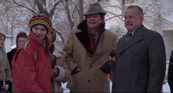 Movie still from “Hardcore” (1979), directed by Paul Schrader – A group of people standing next to each other in the snow; Medium shot, Low angle