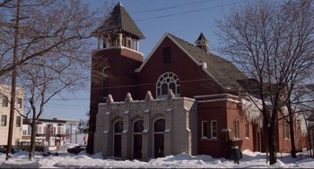 Movie still from “Hardcore” (1979), directed by Paul Schrader – A church with a steeple in the middle of the snow; Extreme Wide shot, Low angle
