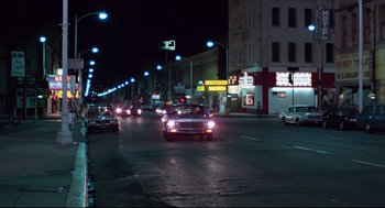 Movie still from “Hardcore” (1979), directed by Paul Schrader – A car driving down a street at night; Extreme Wide shot, Low angle