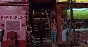 Movie still from “Hardcore” (1979), directed by Paul Schrader – A group of people standing on the steps of a building; Wide shot, High angle