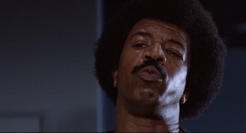 Movie still from “Hardcore” (1979), directed by Paul Schrader – A person with a beard; Close Up shot, Low angle