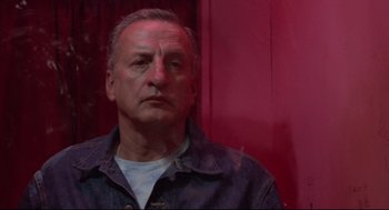 Movie still from “Hardcore” (1979), directed by Paul Schrader – A person wearing a jean jacket; Close Up shot, Low angle
