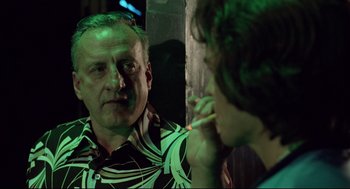 Movie still from “Hardcore” (1979), directed by Paul Schrader – A man looking in the mirror while brushing his teeth; Close Up shot, Over the shoulder angle