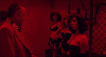 Movie still from “Hardcore” (1979), directed by Paul Schrader – A group of women standing next to each other in lingerie; Medium shot, Over the shoulder angle