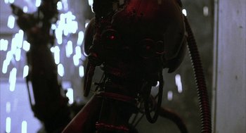 Movie still from “Hardware” (1990), directed by Richard Stanley – View of the head of a robot; Close Up shot, Low angle