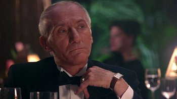 Movie still from “Harlem Nights” (1989), directed by Eddie Murphy – An older man wearing a tuxedo and a bow tie; Close Up shot, Low angle
