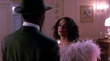 Movie still from “Harlem Nights” (1989), directed by Eddie Murphy – A man and a woman are looking at one another; Close Up shot, Over the shoulder angle
