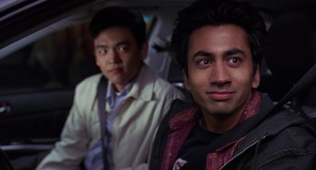 Movie still from “Harold & Kumar Go to White Castle” (2004), directed by Danny Leiner – Two men sitting in the back seat of a car; Close Up shot, Over the shoulder angle