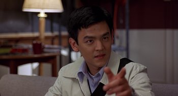 Movie still from “Harold & Kumar Go to White Castle” (2004), directed by Danny Leiner – A man in a white jacket talking to someone; Close Up shot, Over the shoulder angle