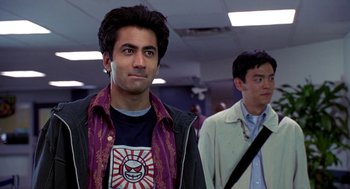 Movie still from “Harold & Kumar Go to White Castle” (2004), directed by Danny Leiner – A man in a purple shirt and a man in a purple jacket; Close Up shot, Over the shoulder angle