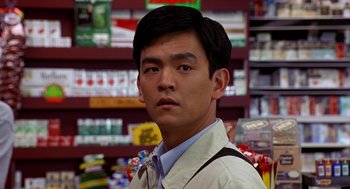 Movie still from “Harold & Kumar Go to White Castle” (2004), directed by Danny Leiner – A man standing in front of a shelf in a store; Close Up shot, Over the shoulder angle
