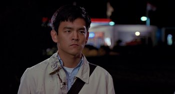 Movie still from “Harold & Kumar Go to White Castle” (2004), directed by Danny Leiner – A young man with blood on his shirt and jacket; Close Up shot, Over the shoulder angle