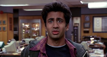 Movie still from “Harold & Kumar Go to White Castle” (2004), directed by Danny Leiner – A person wearing a shirt and jacket; Close Up shot, High angle