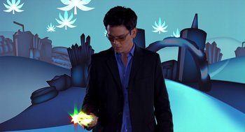 Movie still from “Harold & Kumar Go to White Castle” (2004), directed by Danny Leiner – A man in a black suit holding a lit up object; Medium shot, Low angle