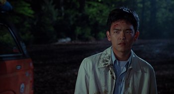 Movie still from “Harold & Kumar Go to White Castle” (2004), directed by Danny Leiner – A young man with blood all over his face; Close Up shot, Over the shoulder angle