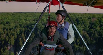 Movie still from “Harold & Kumar Go to White Castle” (2004), directed by Danny Leiner – Two men are hanging upside down in a hang glider; Medium shot, Overhead angle