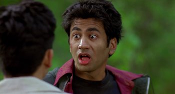 Movie still from “Harold & Kumar Go to White Castle” (2004), directed by Danny Leiner – A person with his mouth wide open; Close Up shot, Over the shoulder angle
