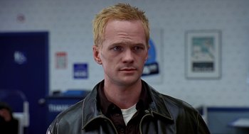 Movie still from “Harold & Kumar Go to White Castle” (2004), directed by Danny Leiner – A person wearing a leather jacket; Close Up shot, Low angle