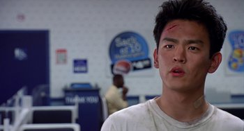 Movie still from “Harold & Kumar Go to White Castle” (2004), directed by Danny Leiner – A man with a bandage on his head and forehead; Close Up shot, Low angle
